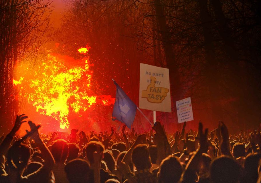 A massive crowd of placard-waving social media fans cheering amidst a blazing forest fire they seem to have started