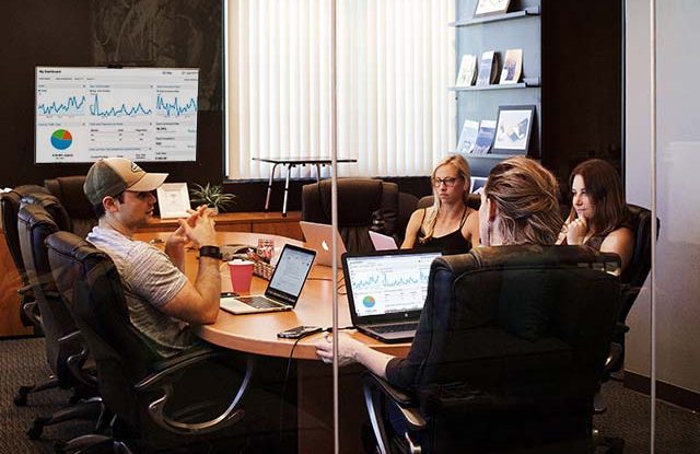 Online Management Meeting Team in conference room for online management meeting, website data analysis and content creation